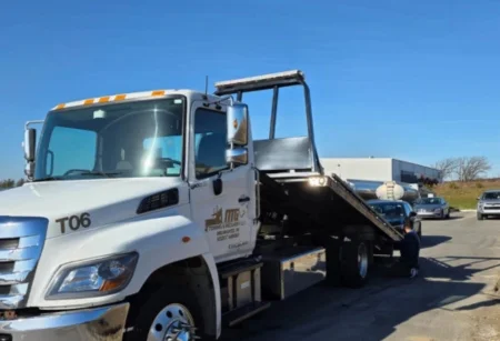 MG Transportation white flatbed tow truck ready for long haul